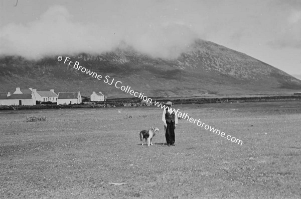 KEEL STRAND FROM RICHVIEW HOTEL WITH MAN AND DOG